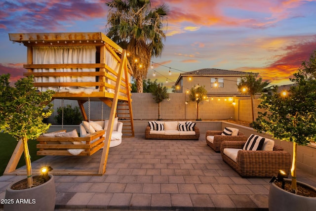 2533 W Novak Way, Phoenix, AZ 85041 - patio terrace at dusk featuring outdoor lounge area and a fenced backyard