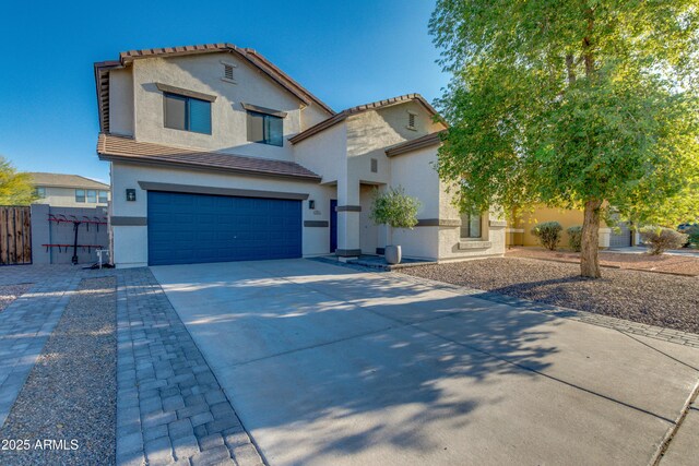2533 W Novak Way, Phoenix, AZ 85041 - view of front facade with stucco siding, an attached garage, concrete driveway, a tile roof, and fence
