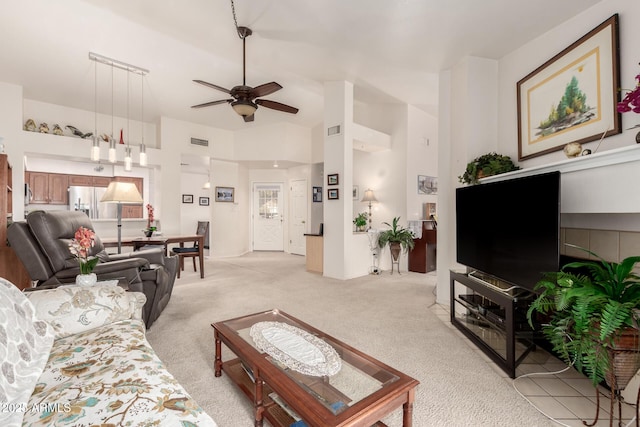 living room with light colored carpet and ceiling fan