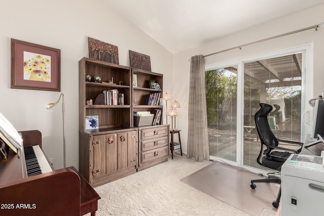 carpeted office with vaulted ceiling