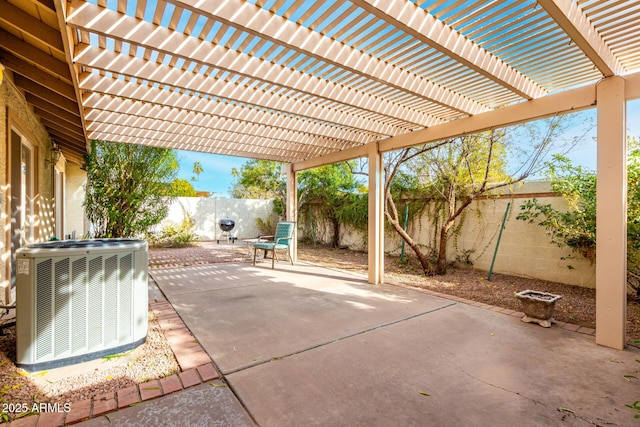 view of patio / terrace with cooling unit and a pergola