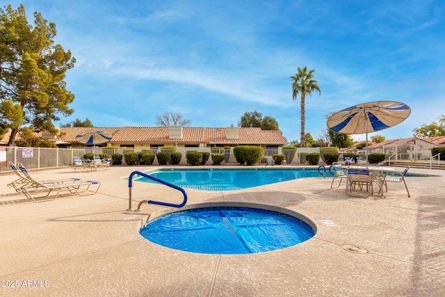 view of pool featuring a patio area and a community hot tub