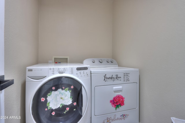 laundry room featuring washer and clothes dryer