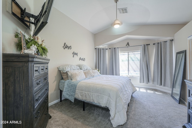 carpeted bedroom with lofted ceiling