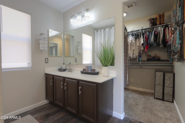 bathroom featuring vanity and hardwood / wood-style floors