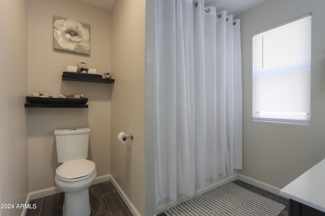 bathroom featuring a shower with curtain, vanity, hardwood / wood-style floors, and toilet