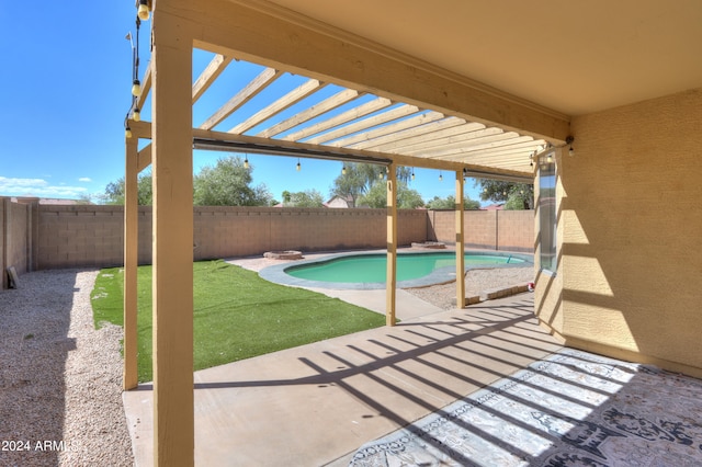 view of swimming pool featuring a lawn, a patio, and a pergola