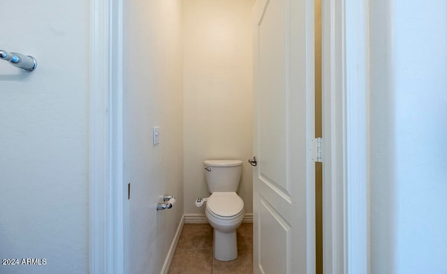 bathroom featuring tile patterned floors and toilet