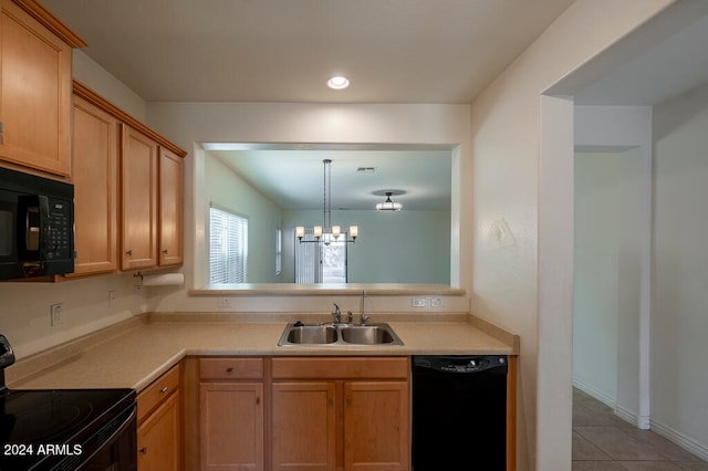 kitchen featuring an inviting chandelier, black appliances, sink, hanging light fixtures, and light tile patterned flooring