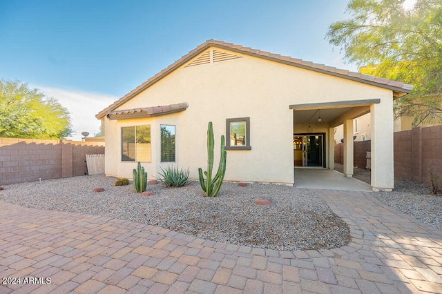 back of property with a patio area