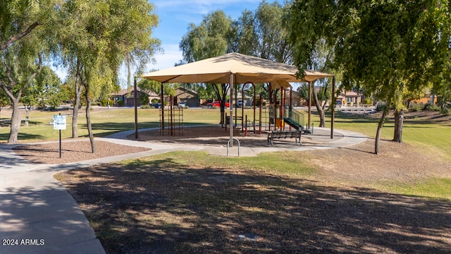 view of jungle gym featuring a lawn