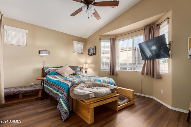 bedroom with ceiling fan, dark hardwood / wood-style floors, and lofted ceiling