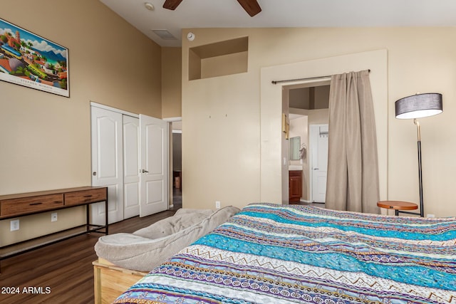 bedroom with ceiling fan, vaulted ceiling, dark wood-type flooring, and a closet