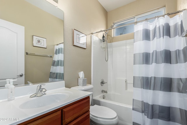 full bathroom with vanity, toilet, and shower / tub combo with curtain