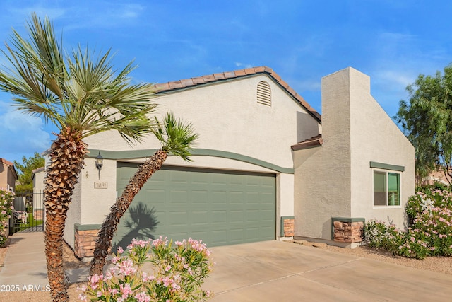 7031 S 32nd Pl, Phoenix, AZ 85042 - view of front facade with stucco siding, driveway, and a garage