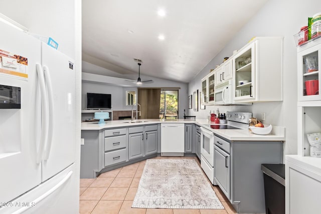7031 S 32nd Pl, Phoenix, AZ 85042 - kitchen featuring white appliances, gray cabinetry, vaulted ceiling, glass insert cabinets, and a sink