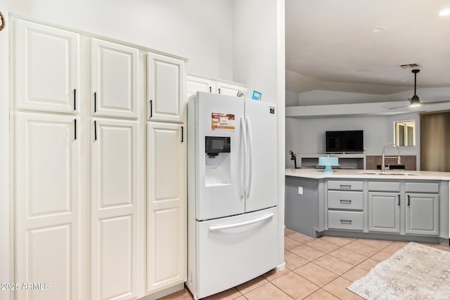 7031 S 32nd Pl, Phoenix, AZ 85042 - kitchen featuring white refrigerator with ice dispenser, a sink, gray cabinetry, lofted ceiling, and light tile patterned floors