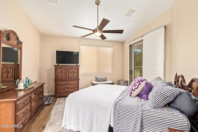 7031 S 32nd Pl, Phoenix, AZ 85042 - bedroom featuring wood finished floors, access to exterior, a ceiling fan, and baseboards