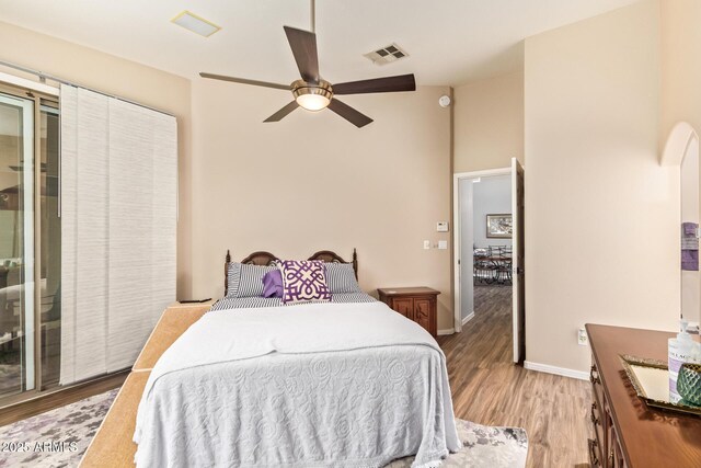 7031 S 32nd Pl, Phoenix, AZ 85042 - bedroom with light wood finished floors, baseboards, and ceiling fan