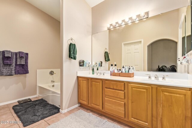 7031 S 32nd Pl, Phoenix, AZ 85042 - full bathroom with tile patterned flooring, double vanity, a garden tub, and baseboards