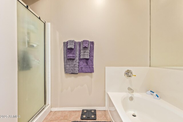 7031 S 32nd Pl, Phoenix, AZ 85042 - full bath featuring a shower stall, a bath, tile patterned floors, and baseboards