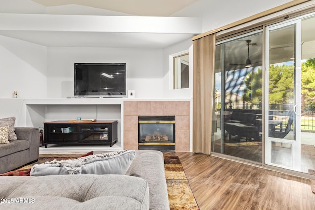 7031 S 32nd Pl, Phoenix, AZ 85042 - living area with wood finished floors and a tile fireplace