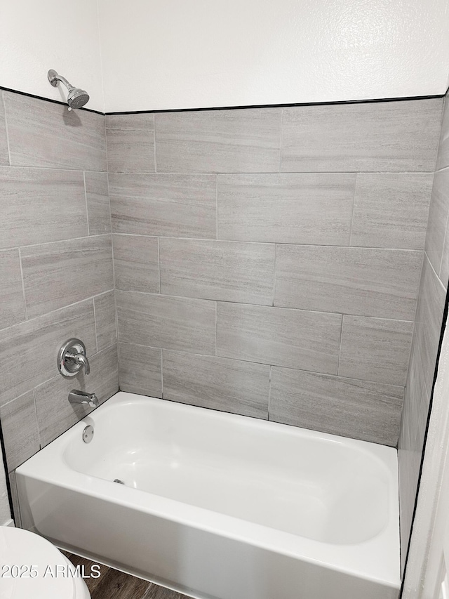 full bath with shower / washtub combination and toilet