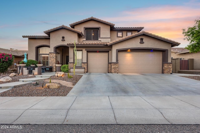 2728 W Adventure Dr, Anthem, AZ 85086 - mediterranean / spanish-style house featuring stucco siding, stone siding, and concrete driveway