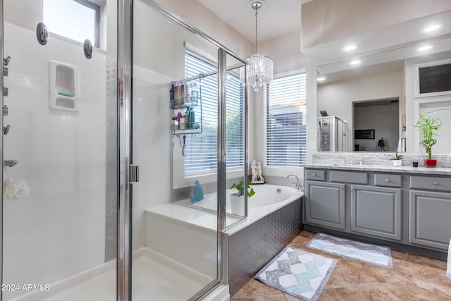 2728 W Adventure Dr, Anthem, AZ 85086 - full bath featuring vanity, a shower stall, a bath, a chandelier, and tile patterned floors