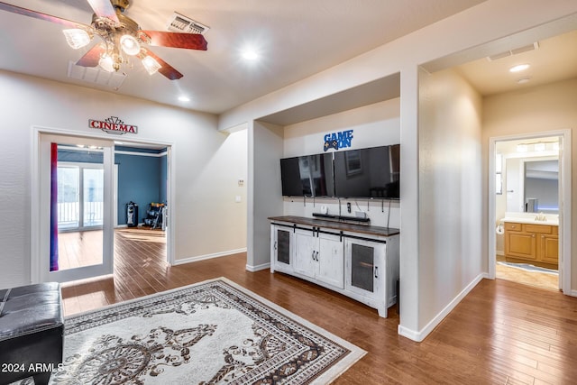 2728 W Adventure Dr, Anthem, AZ 85086 - bar area with ceiling fan, wood finished floors, backsplash, and recessed lighting