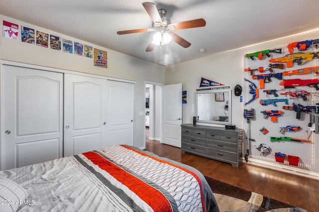 2728 W Adventure Dr, Anthem, AZ 85086 - bedroom with dark wood-style flooring, a closet, and ceiling fan