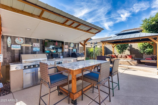 2728 W Adventure Dr, Anthem, AZ 85086 - view of patio / terrace with exterior kitchen, a gazebo, outdoor lounge area, and outdoor dining space