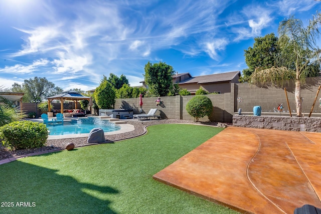 2728 W Adventure Dr, Anthem, AZ 85086 - fenced backyard featuring a gazebo, a jacuzzi, and a patio area