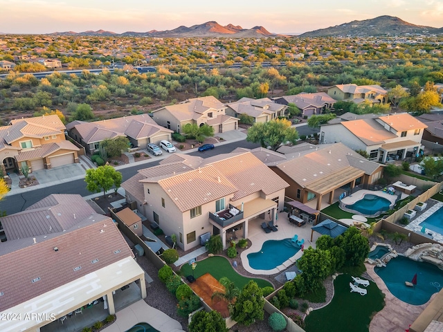 2728 W Adventure Dr, Anthem, AZ 85086 - aerial view at dusk of a residential view, view of pool area, and a mountain view
