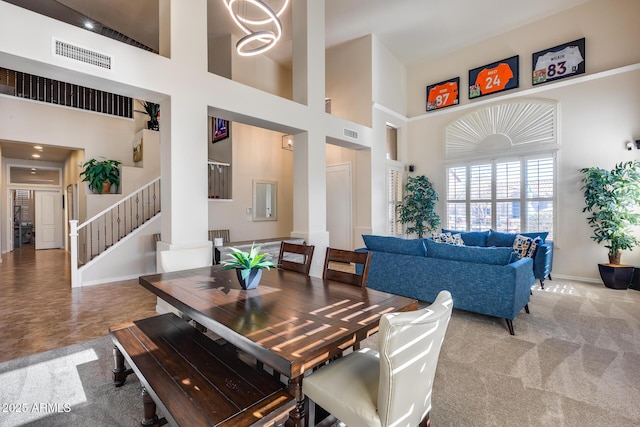 2728 W Adventure Dr, Anthem, AZ 85086 - carpeted dining area with a high ceiling and stairway