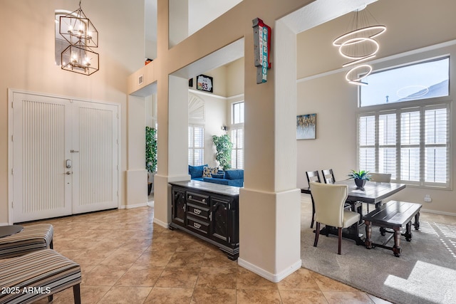 2728 W Adventure Dr, Anthem, AZ 85086 - entrance foyer featuring a chandelier, a high ceiling, and plenty of natural light