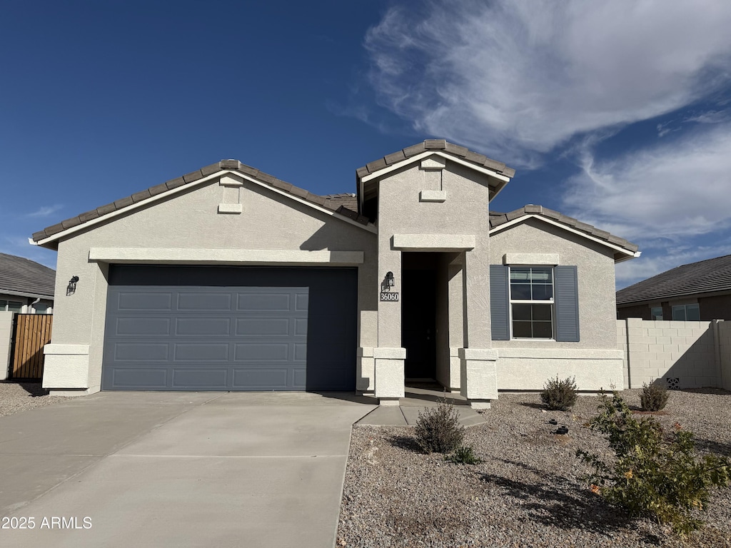 view of front of property with a garage