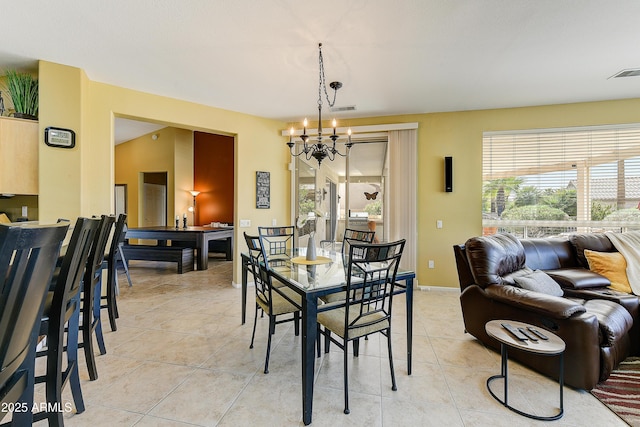20454 N Palm Canyon Dr, Surprise, AZ 85374 - dining room with light tile patterned floors, a notable chandelier, baseboards, and visible vents