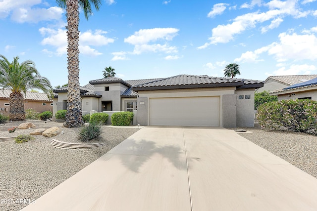 20454 N Palm Canyon Dr, Surprise, AZ 85374 - view of front of property with an attached garage, driveway, stucco siding, and a tile roof