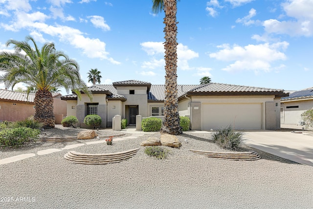 20454 N Palm Canyon Dr, Surprise, AZ 85374 - mediterranean / spanish home with an attached garage, driveway, stucco siding, and a tile roof