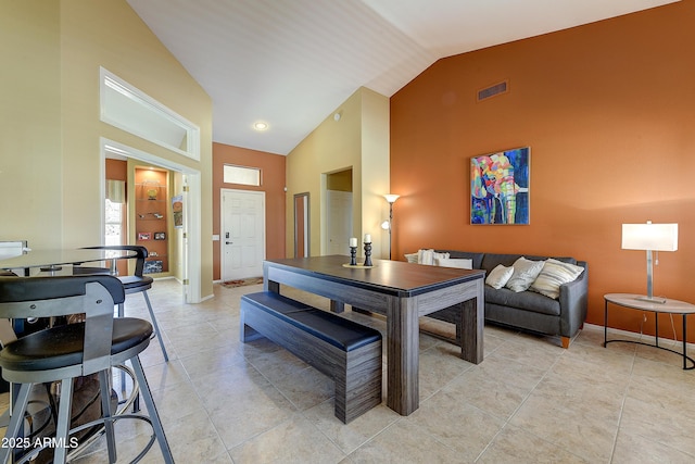 20454 N Palm Canyon Dr, Surprise, AZ 85374 - dining area with light tile patterned flooring, high vaulted ceiling, baseboards, and visible vents