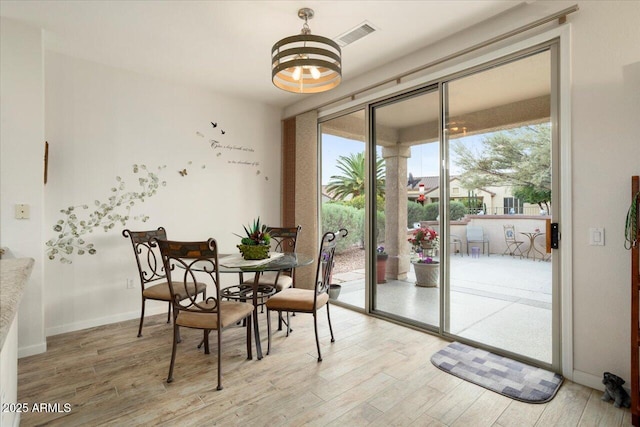 dining space featuring light hardwood / wood-style flooring