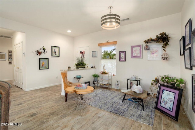 sitting room with light hardwood / wood-style flooring