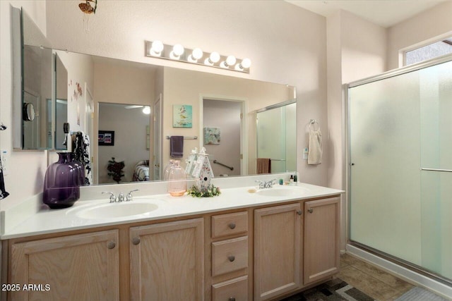 bathroom featuring vanity, tile patterned flooring, and walk in shower