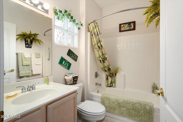 full bathroom with vanity, toilet, and shower / bath combo with shower curtain