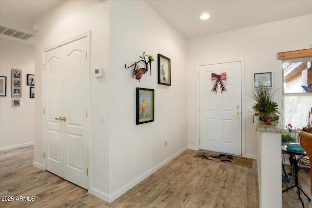 foyer with light hardwood / wood-style flooring