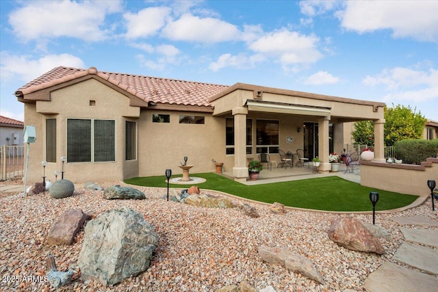 rear view of house with a patio