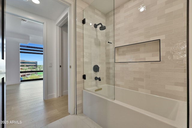 bathroom with shower / tub combination and wood finished floors