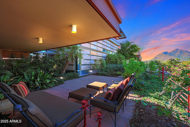 patio terrace at dusk with a mountain view