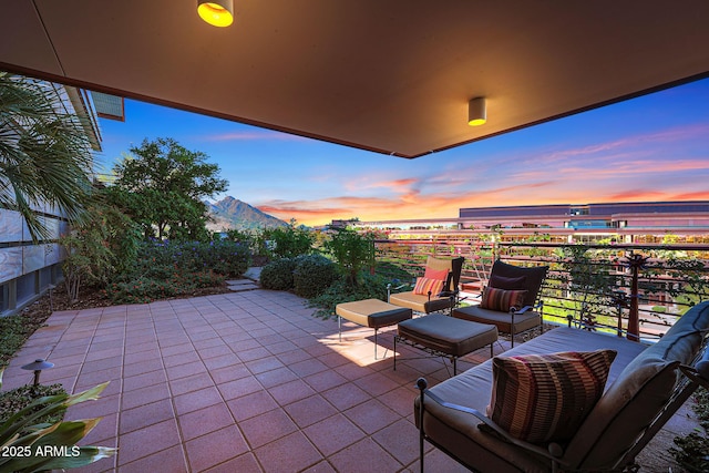 patio terrace at dusk with a balcony